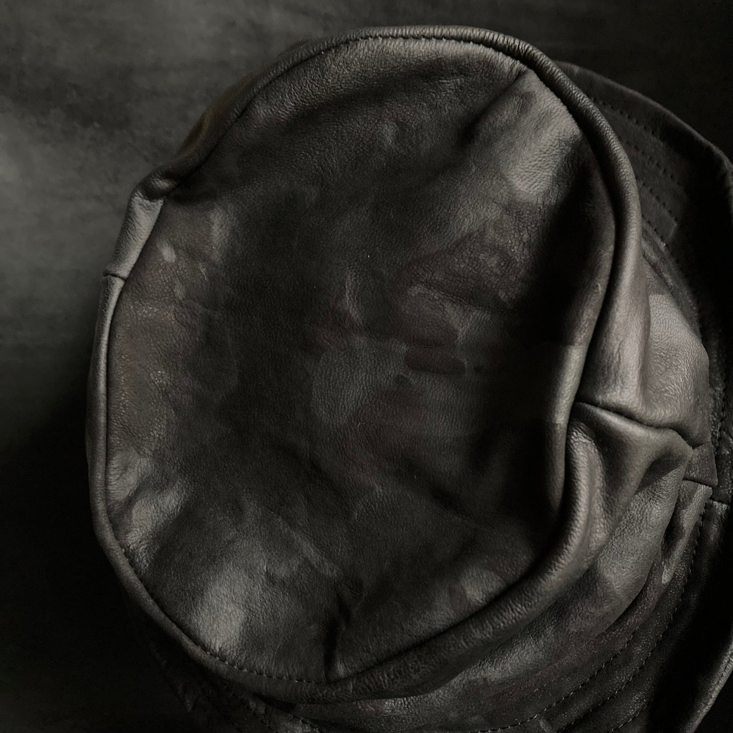 Bleached black leather turn bucket hat