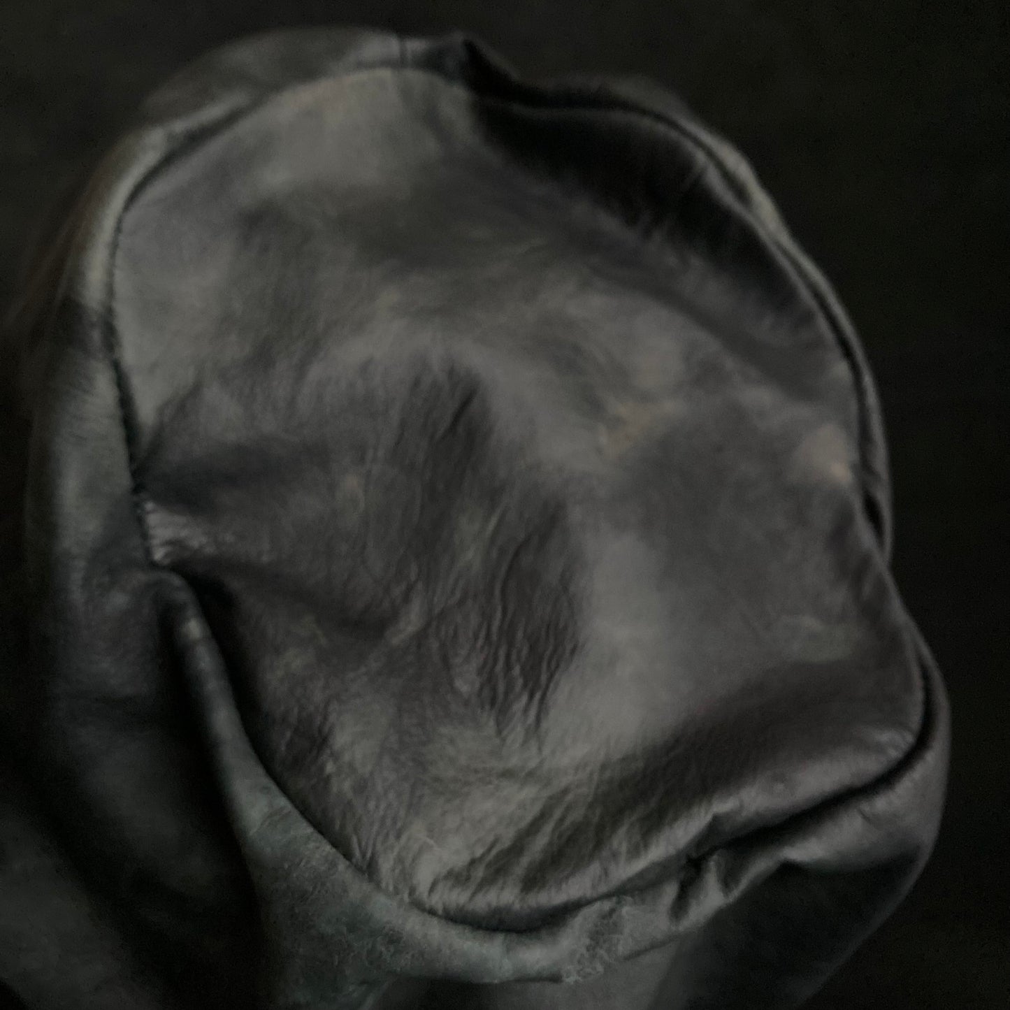 Rainy black leather turn cap