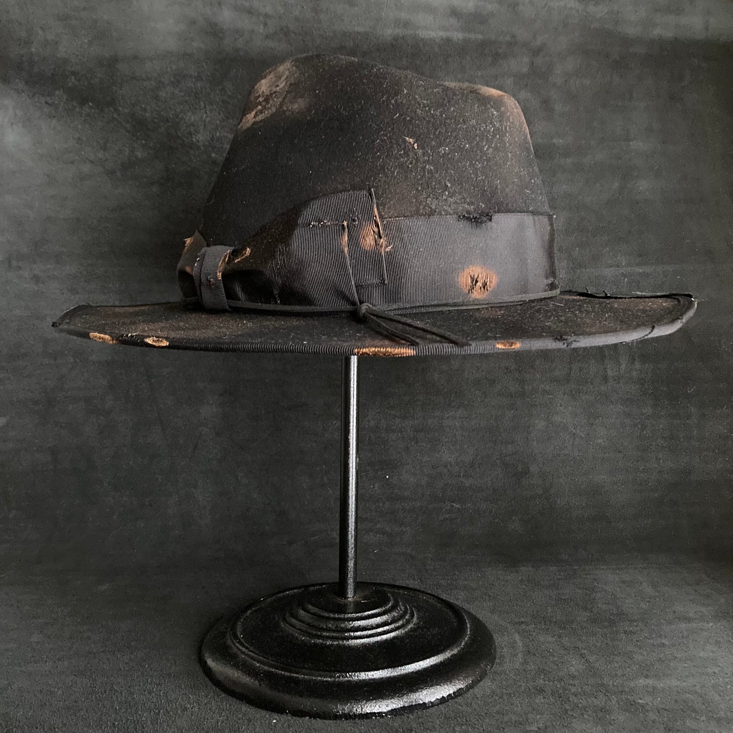 Scorched black fedora hat