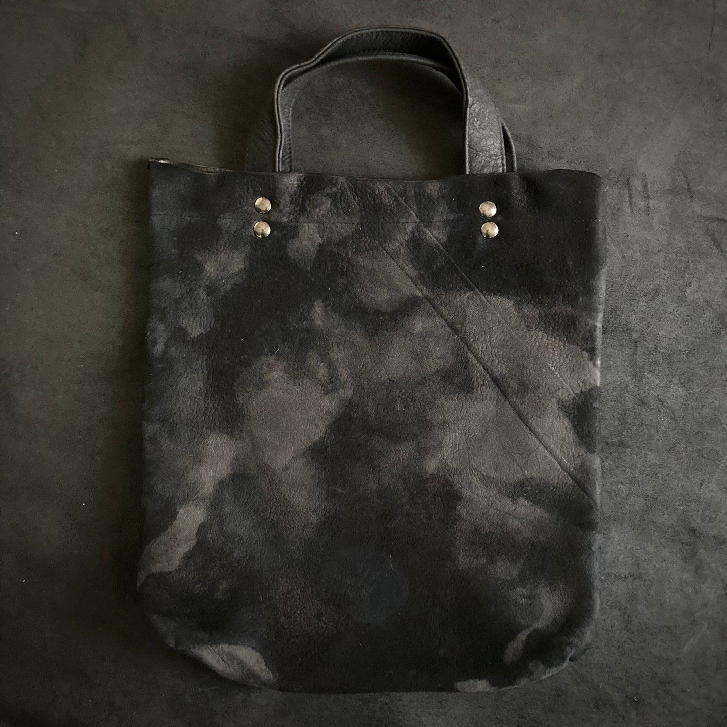 Bleached black leather tote bag
