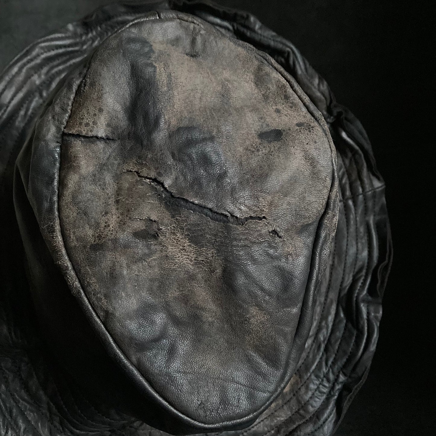Cracked black leather fedora hat