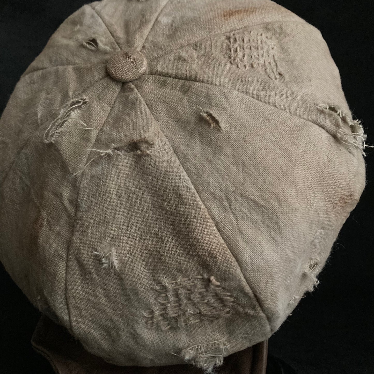 Sand tatters damage linen casquette