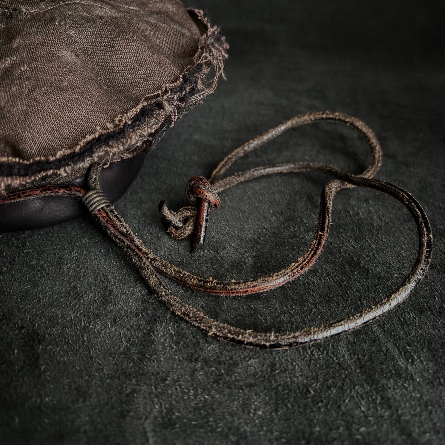 Uneven dyeing, damaged brown linen leather strap beret