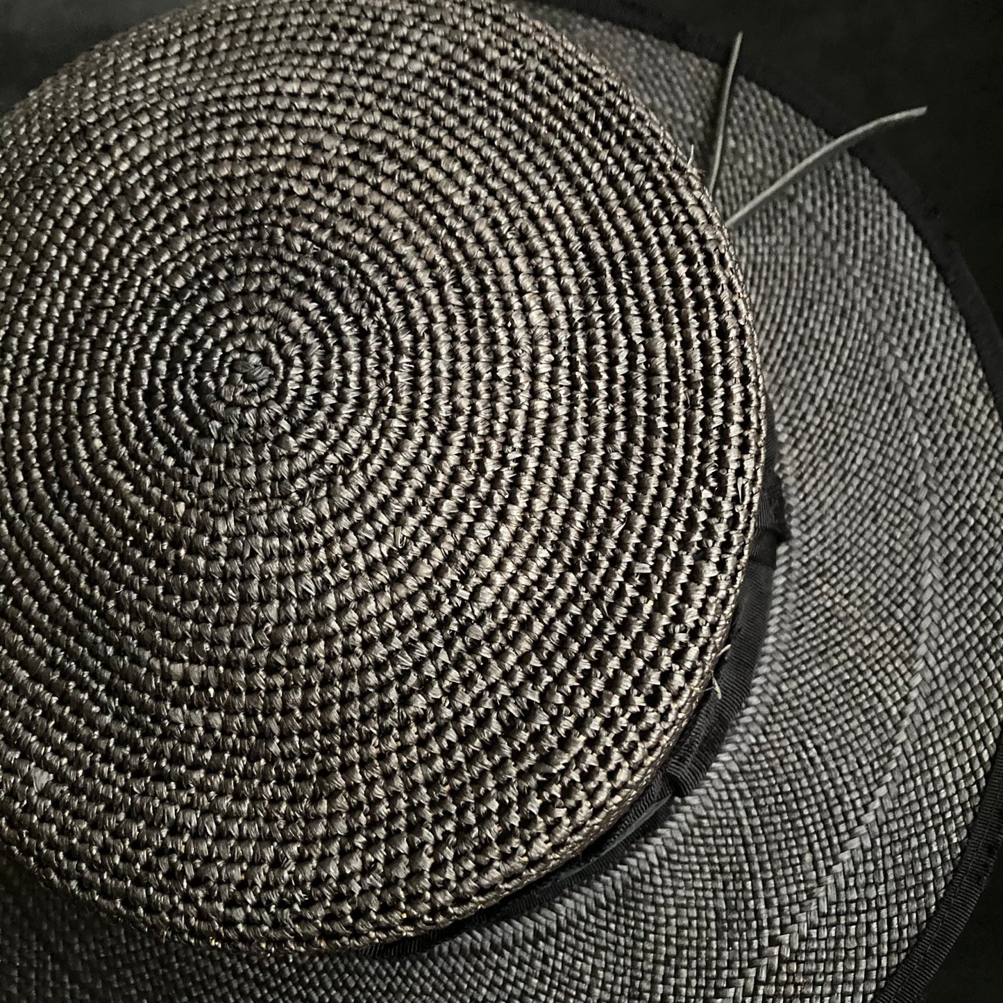 Lined up black flat panama hat