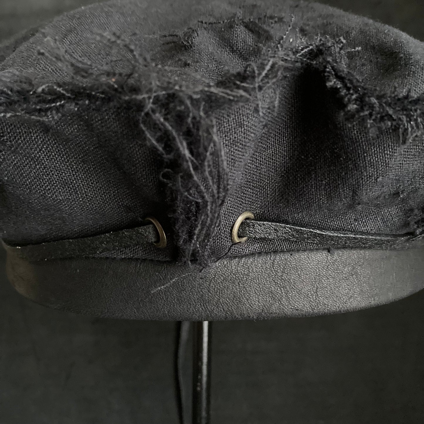 Back side black linen leather strap beret