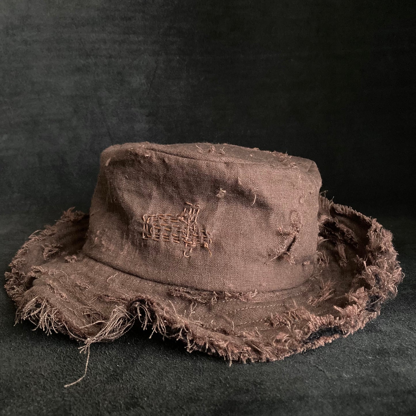 Brown linen damage stitch bucket hat
