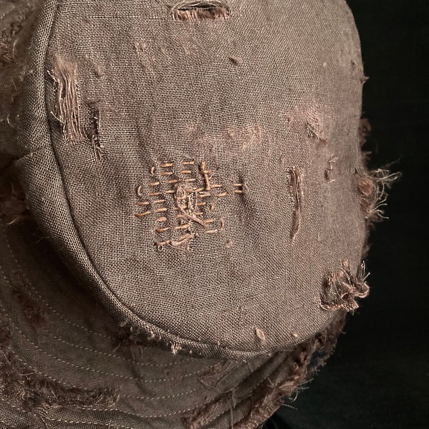 Brown linen damage stitch bucket hat
