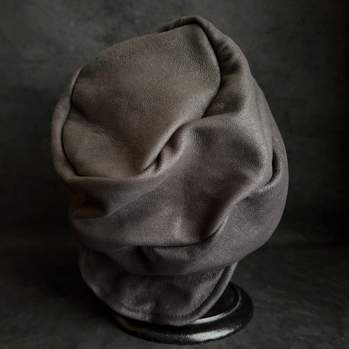 Graphite black leather turn cap