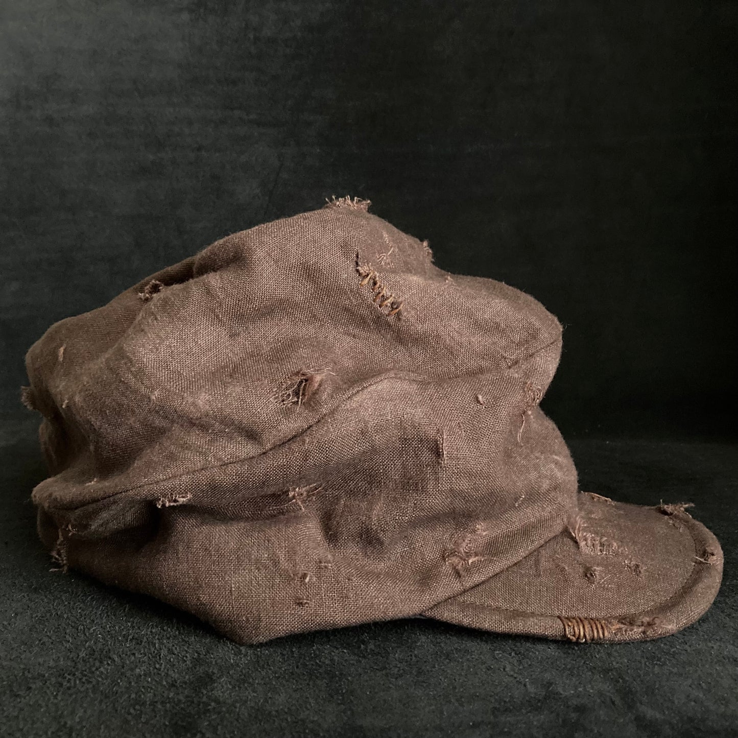 Brown linen damage turn cap (brim core)