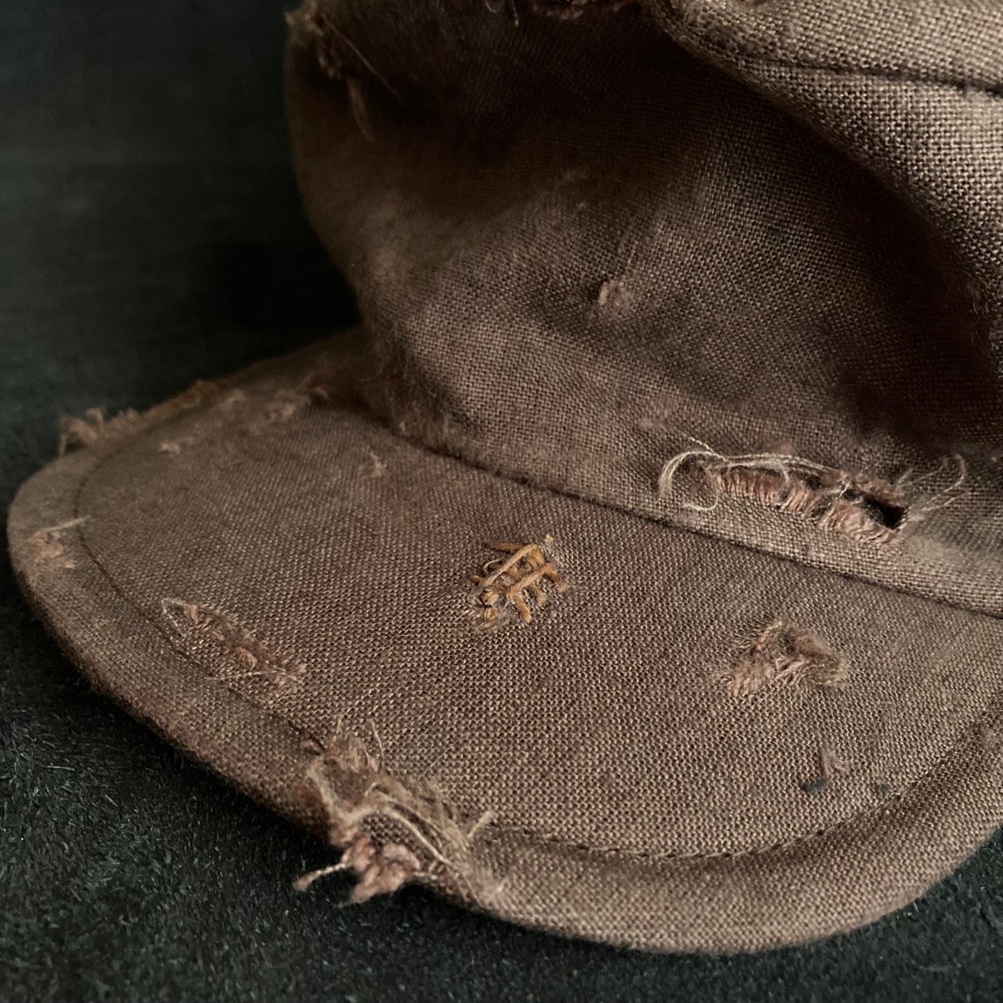 Brown linen damage turn cap (brim core)