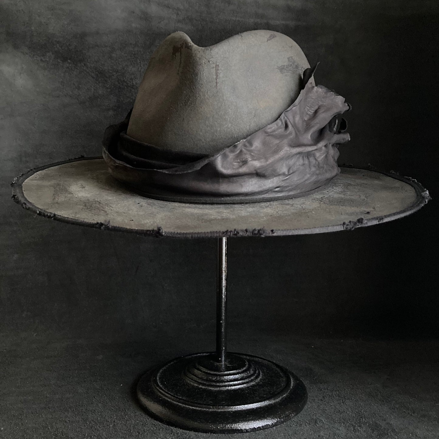 Charcoal leather erodes fedora hat