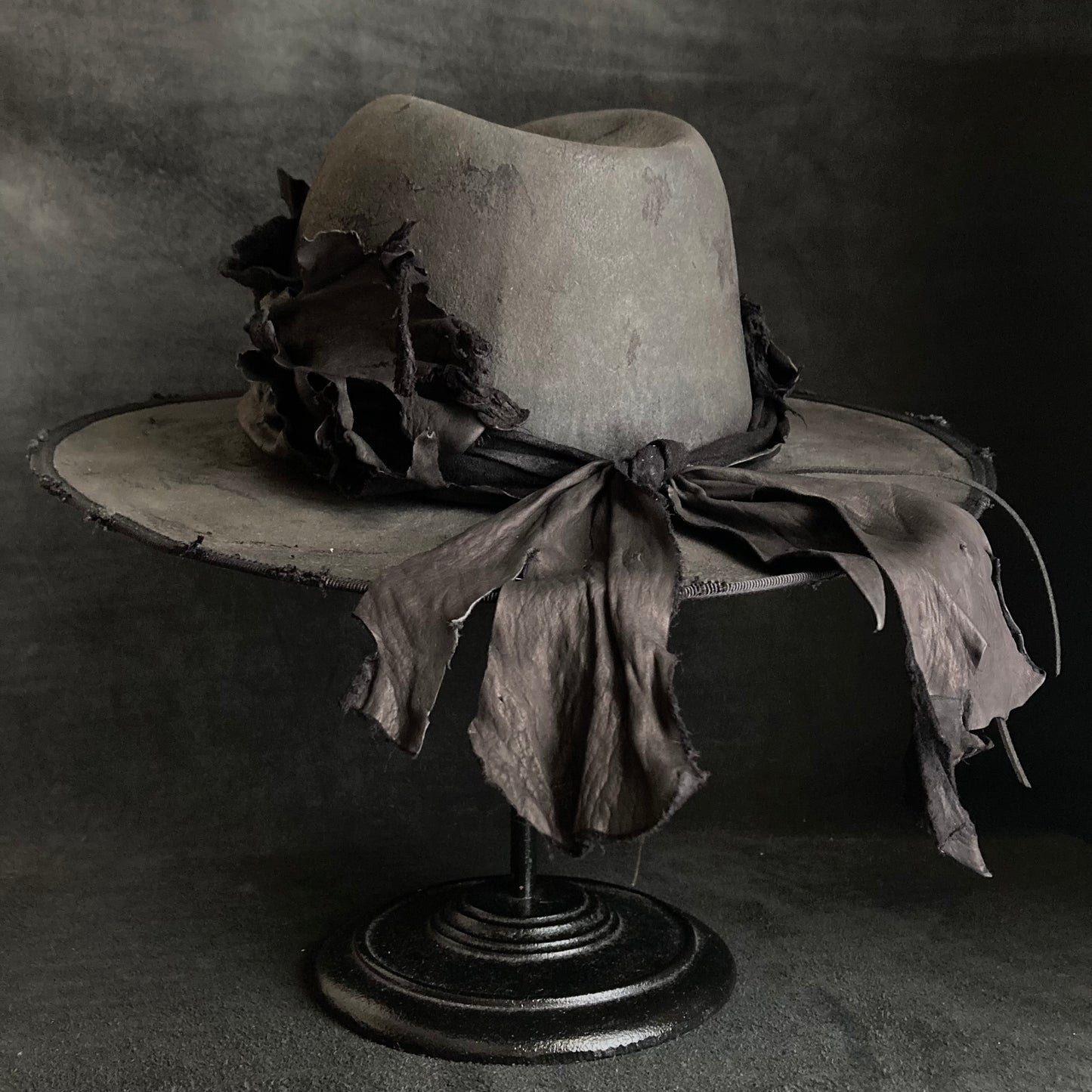 Charcoal leather erodes fedora hat