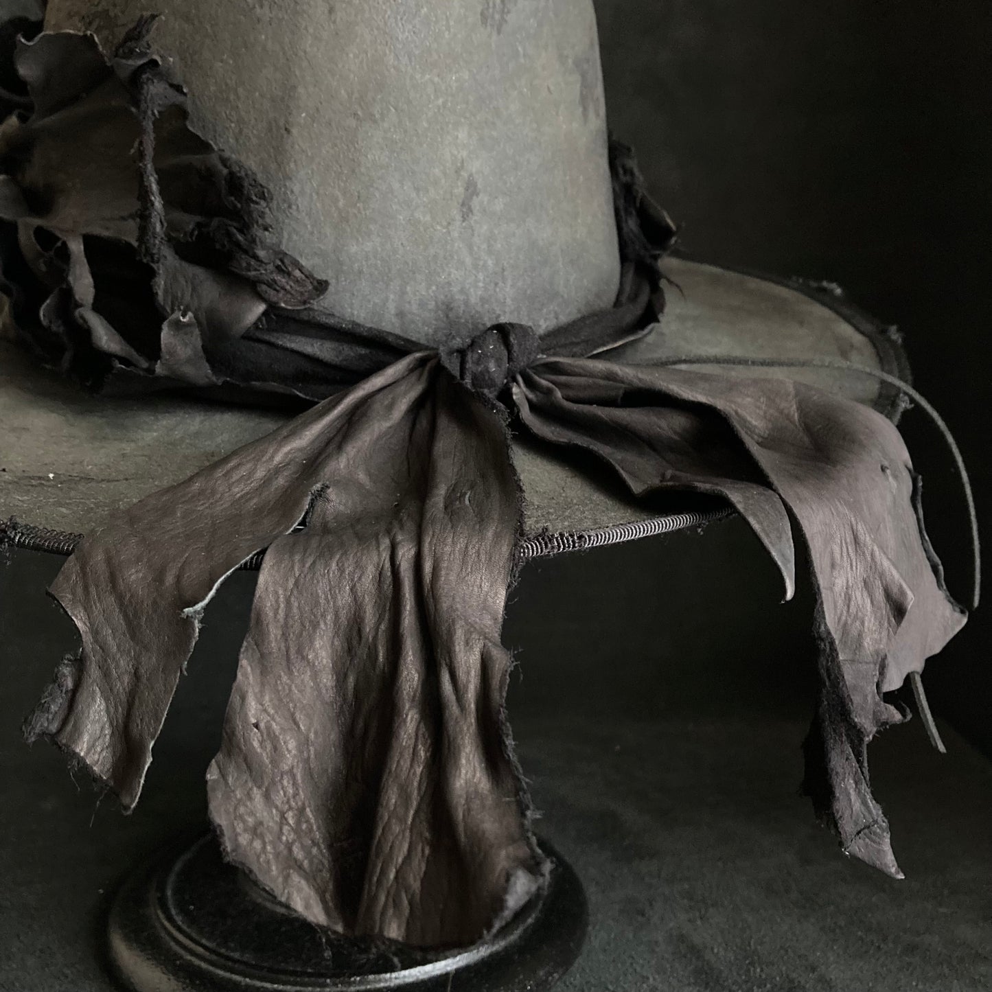 Charcoal leather erodes fedora hat