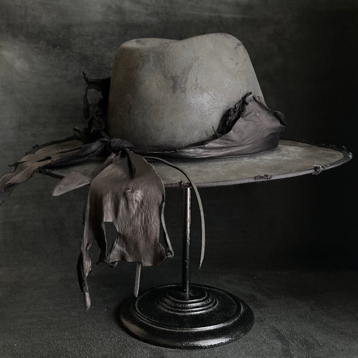 Charcoal leather erodes fedora hat