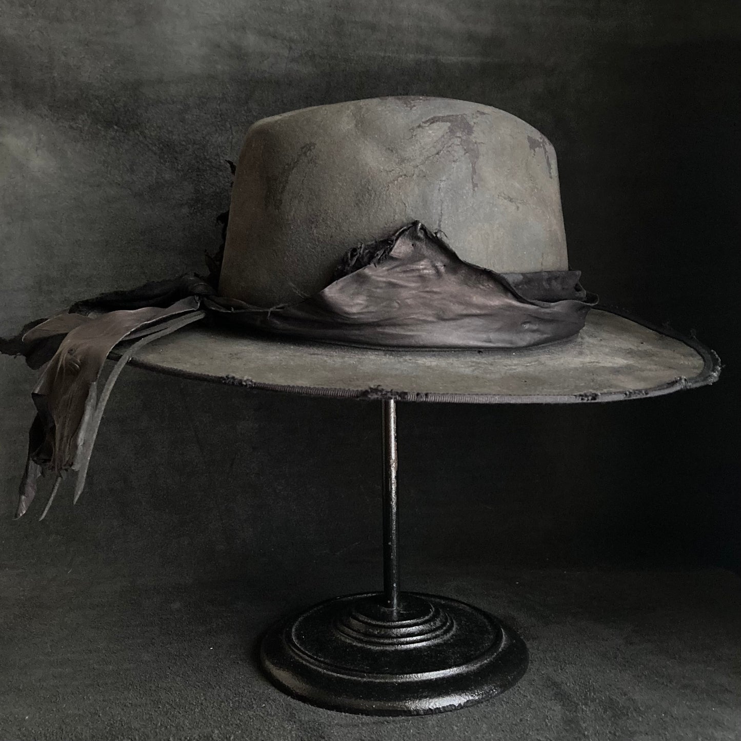 Charcoal leather erodes fedora hat