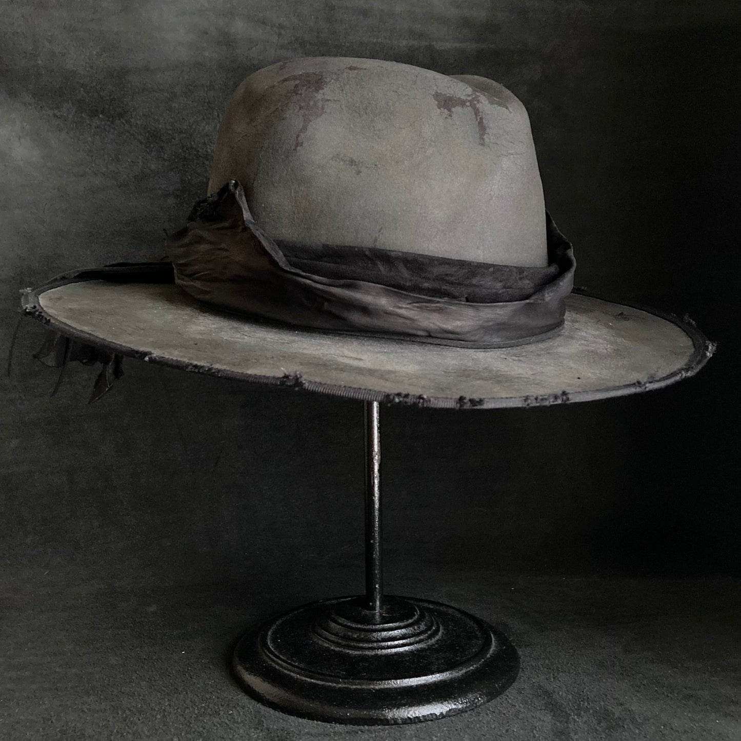 Charcoal leather erodes fedora hat