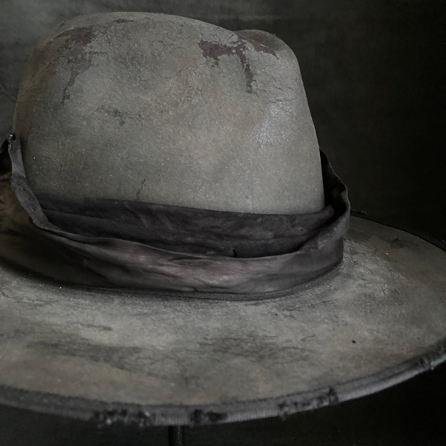 Charcoal leather erodes fedora hat