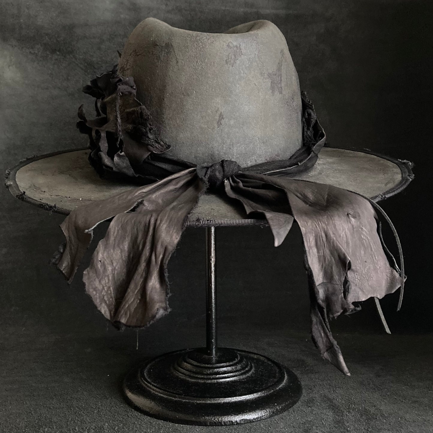 Charcoal leather erodes fedora hat
