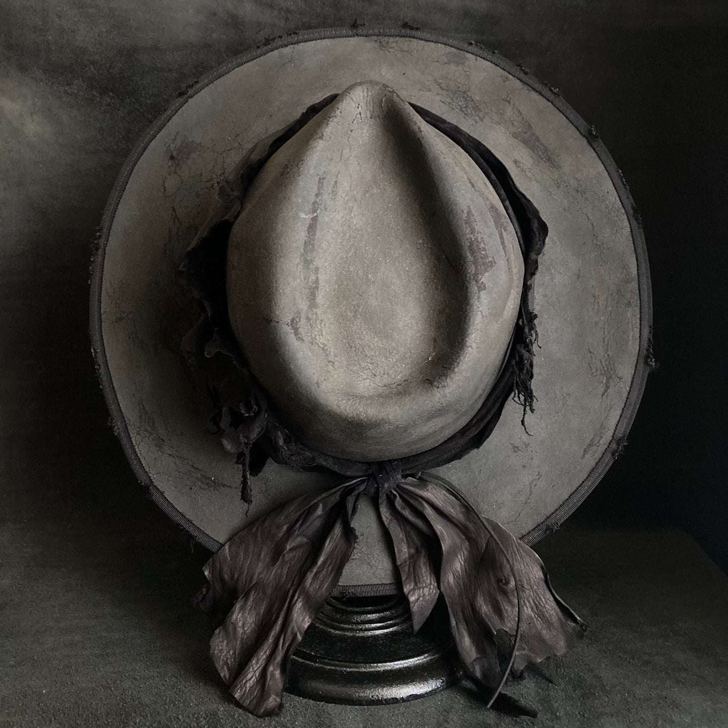 Charcoal leather erodes fedora hat