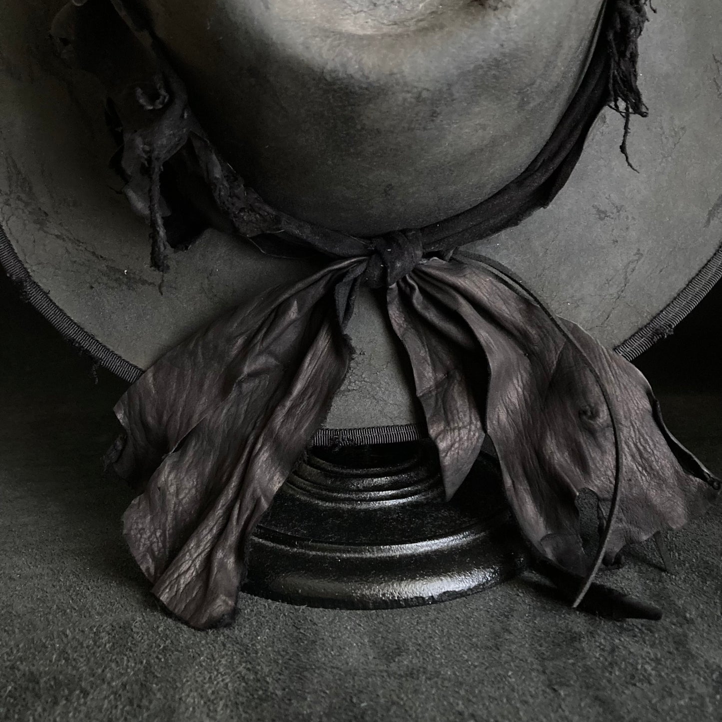 Charcoal leather erodes fedora hat