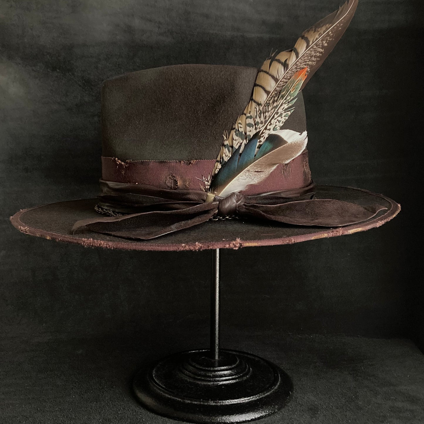 Dark brown flies away burned fedora hat