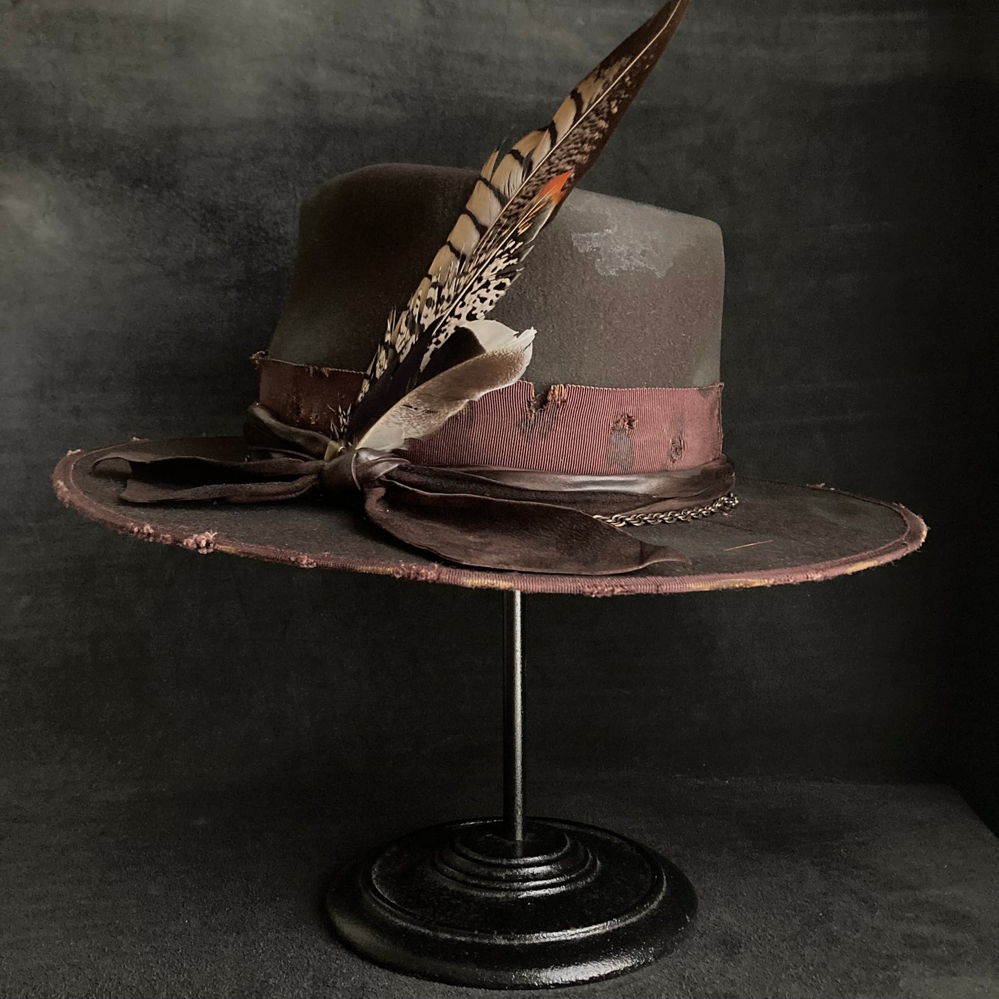 Dark brown flies away burned fedora hat