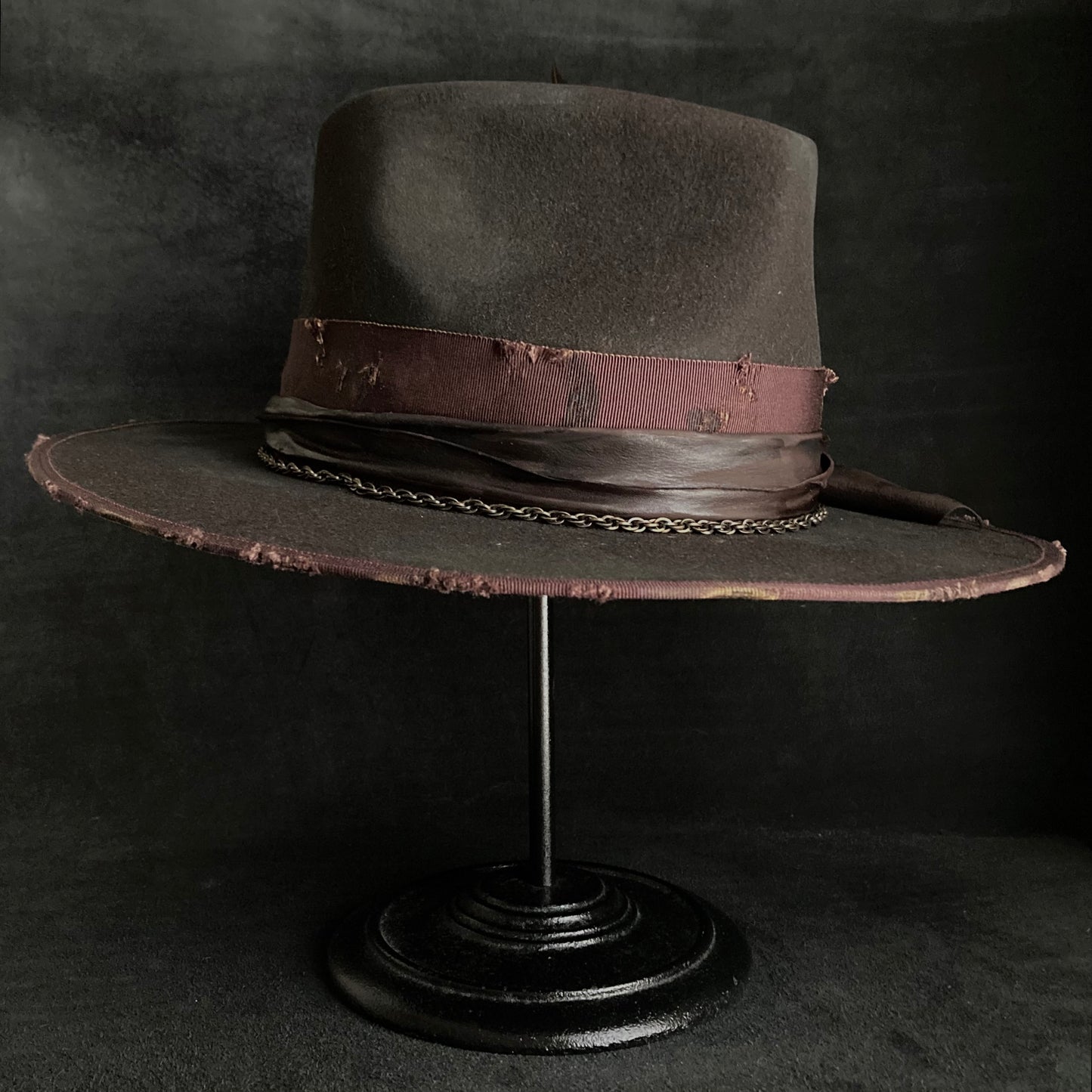 Dark brown flies away burned fedora hat