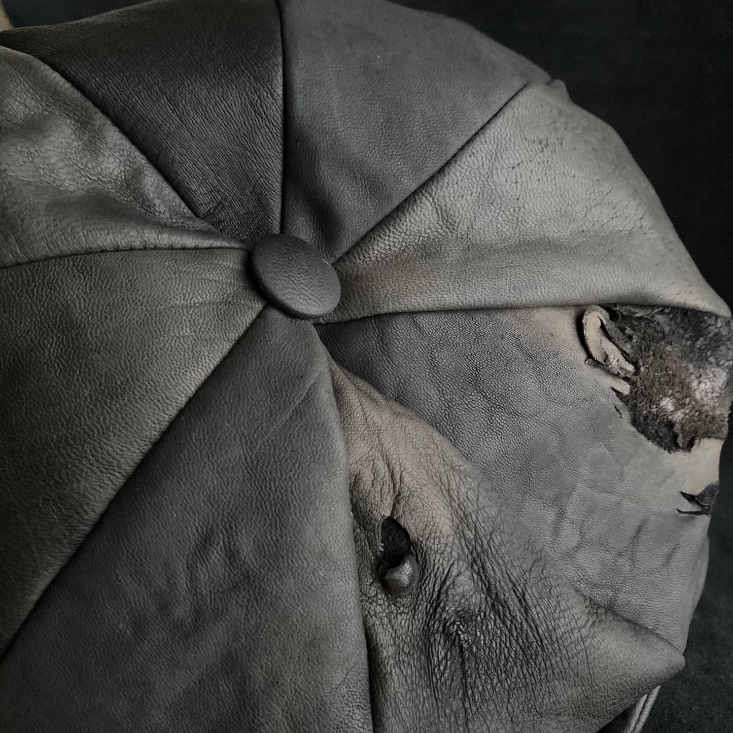 Deep claw marks gray leather casquette