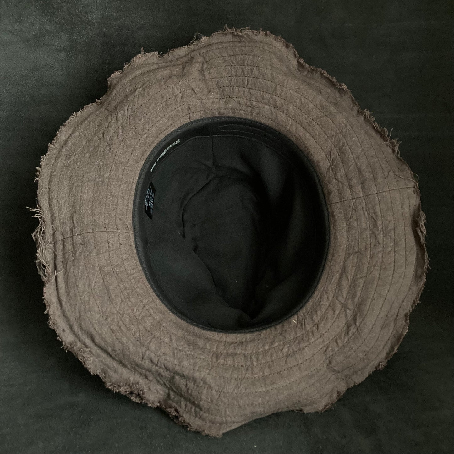 Fraying damage brown cotton-linen fedora hat