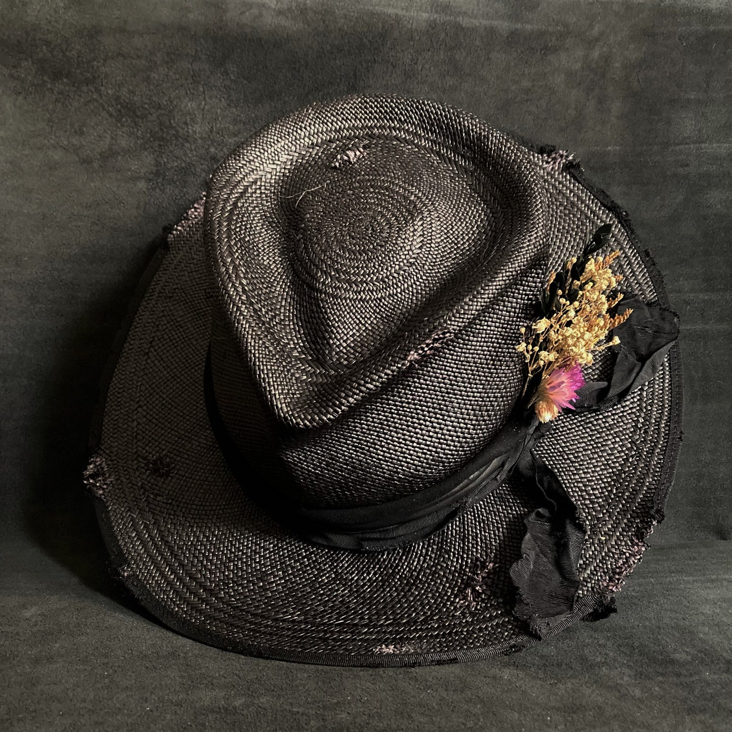Black damaged panama hat