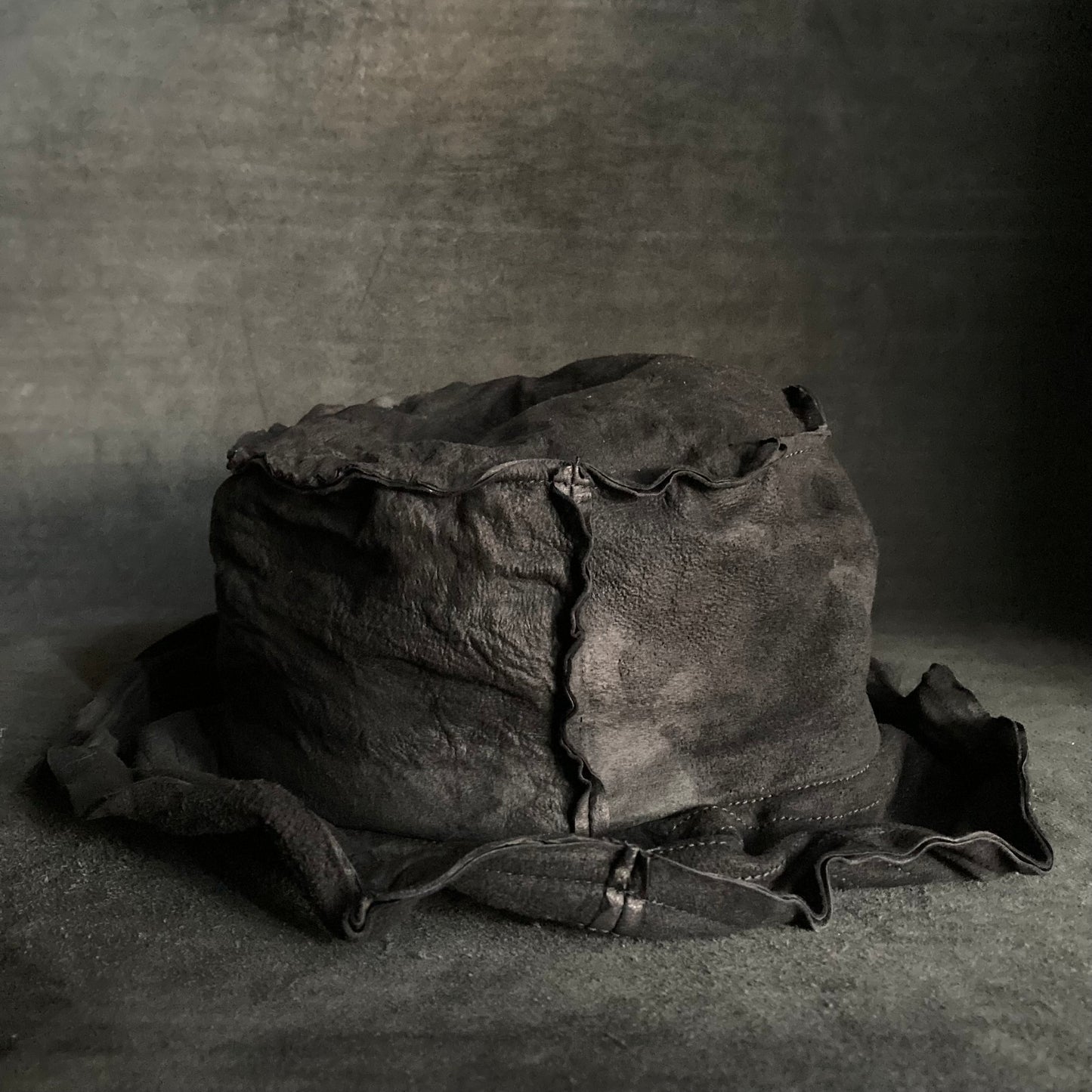 Bleach wash crumpled black leather bucket