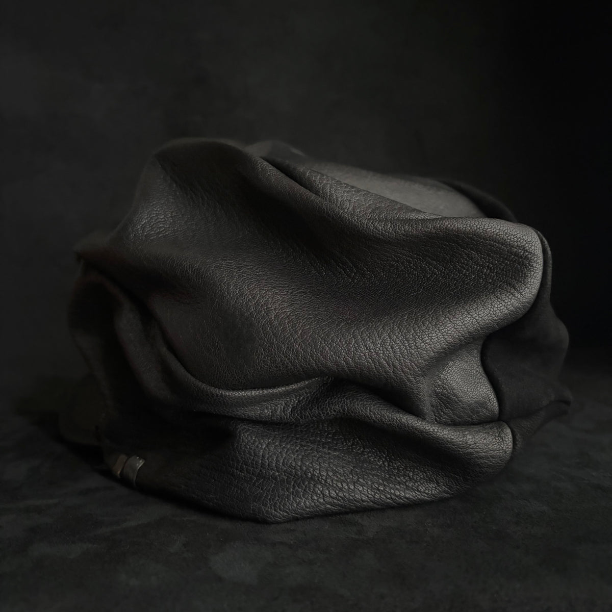 Grit black leather turn cap
