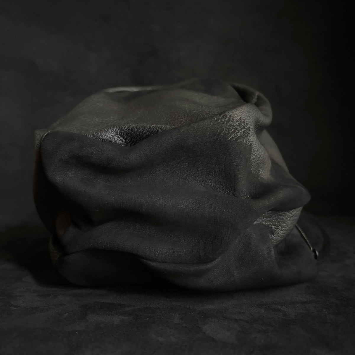 Grit black leather turn cap
