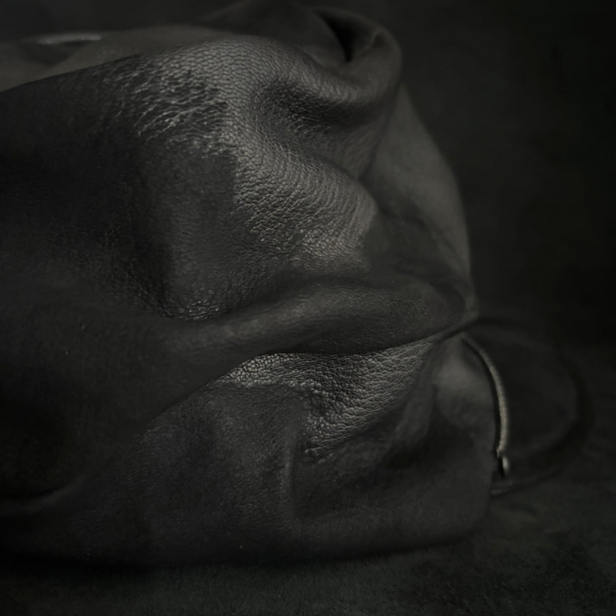 Grit black leather turn cap