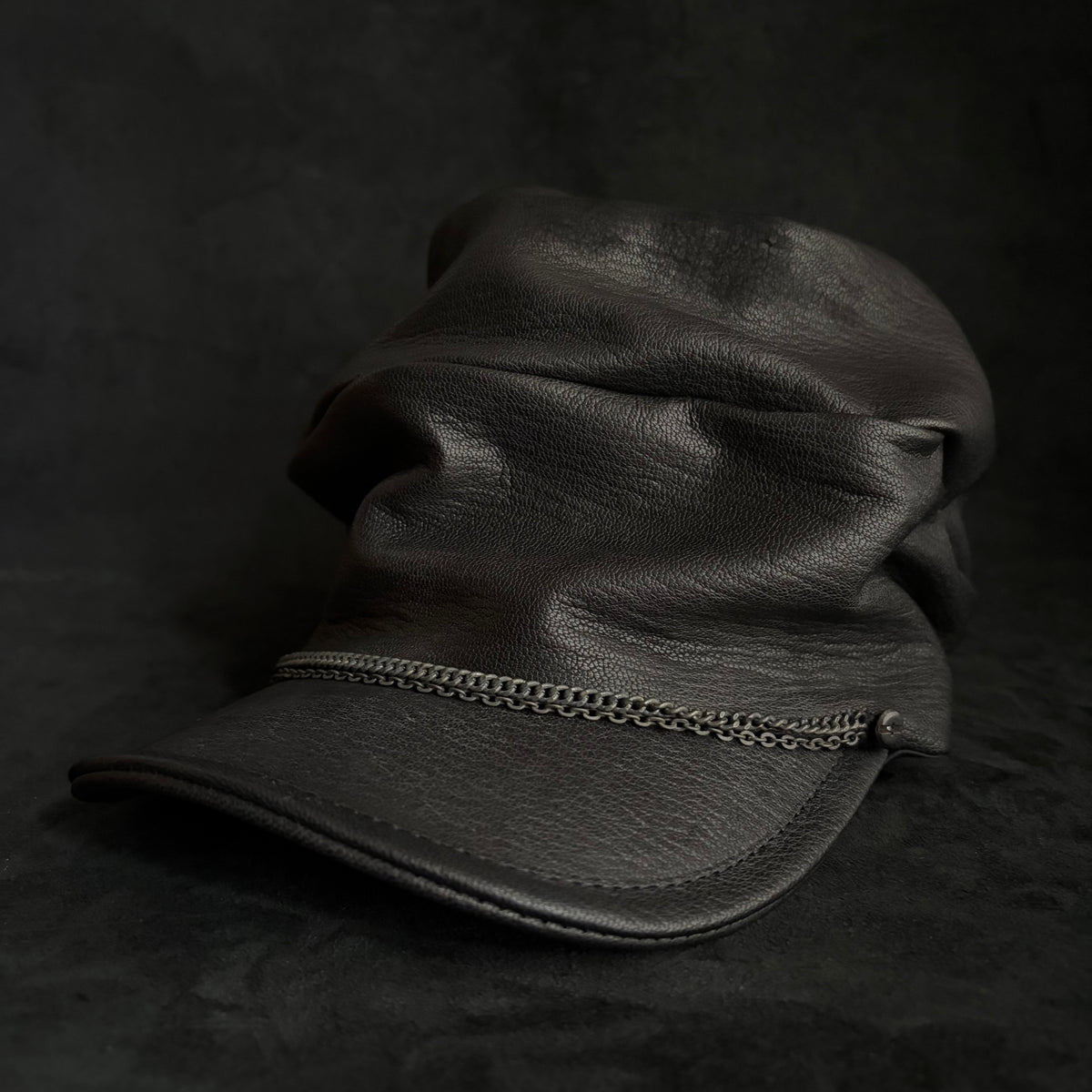 Grit black leather turn cap