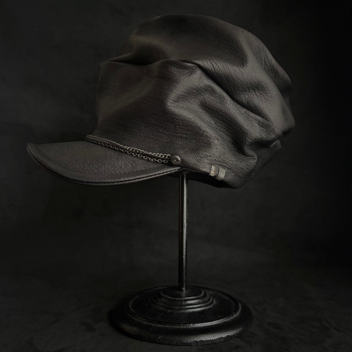 Grit black leather turn cap