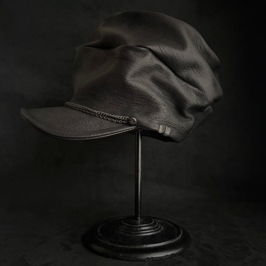 Grit black leather turn cap