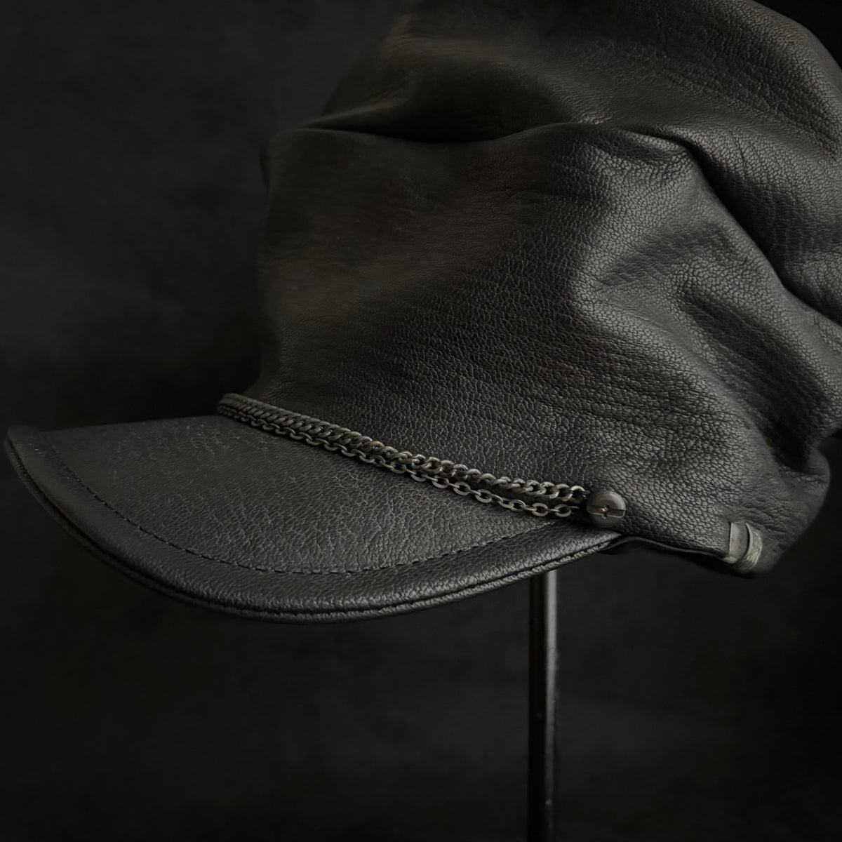 Grit black leather turn cap