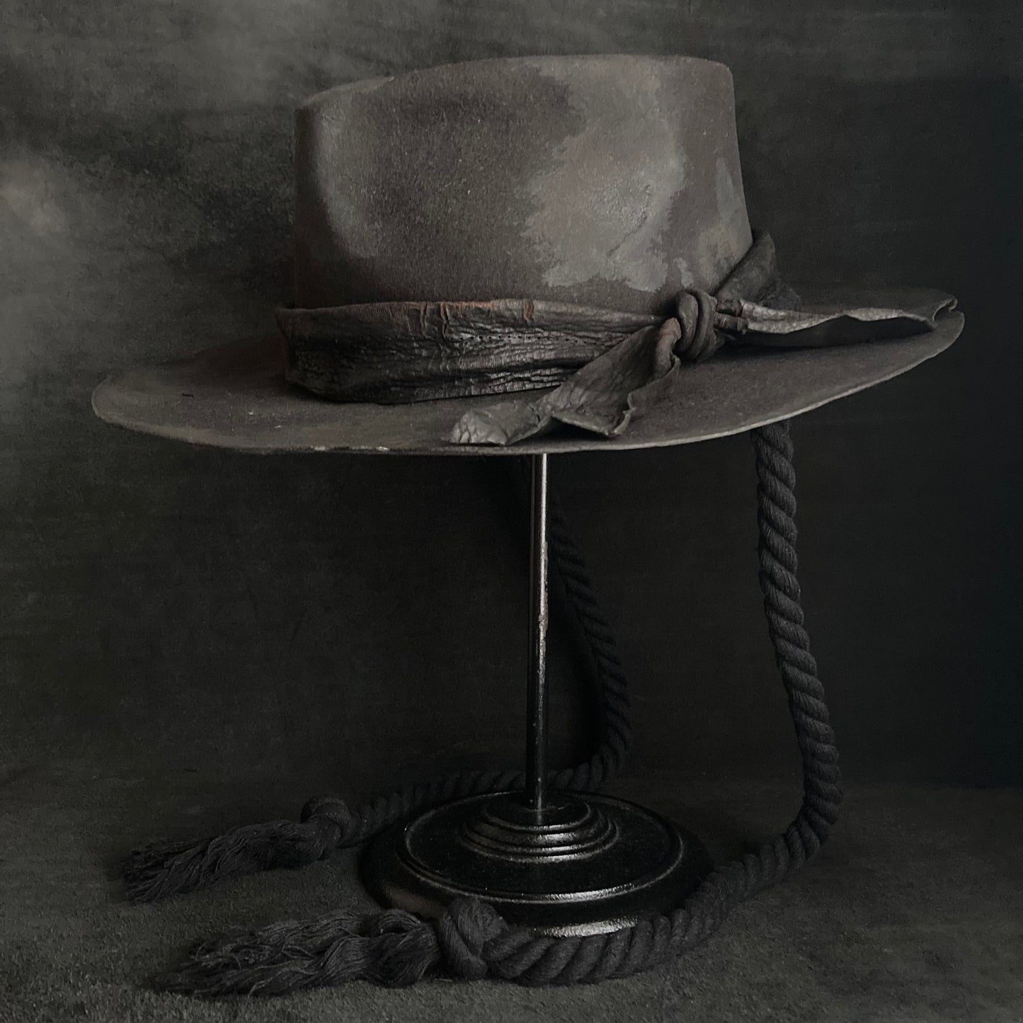 Burned black fedora hanging rope hat