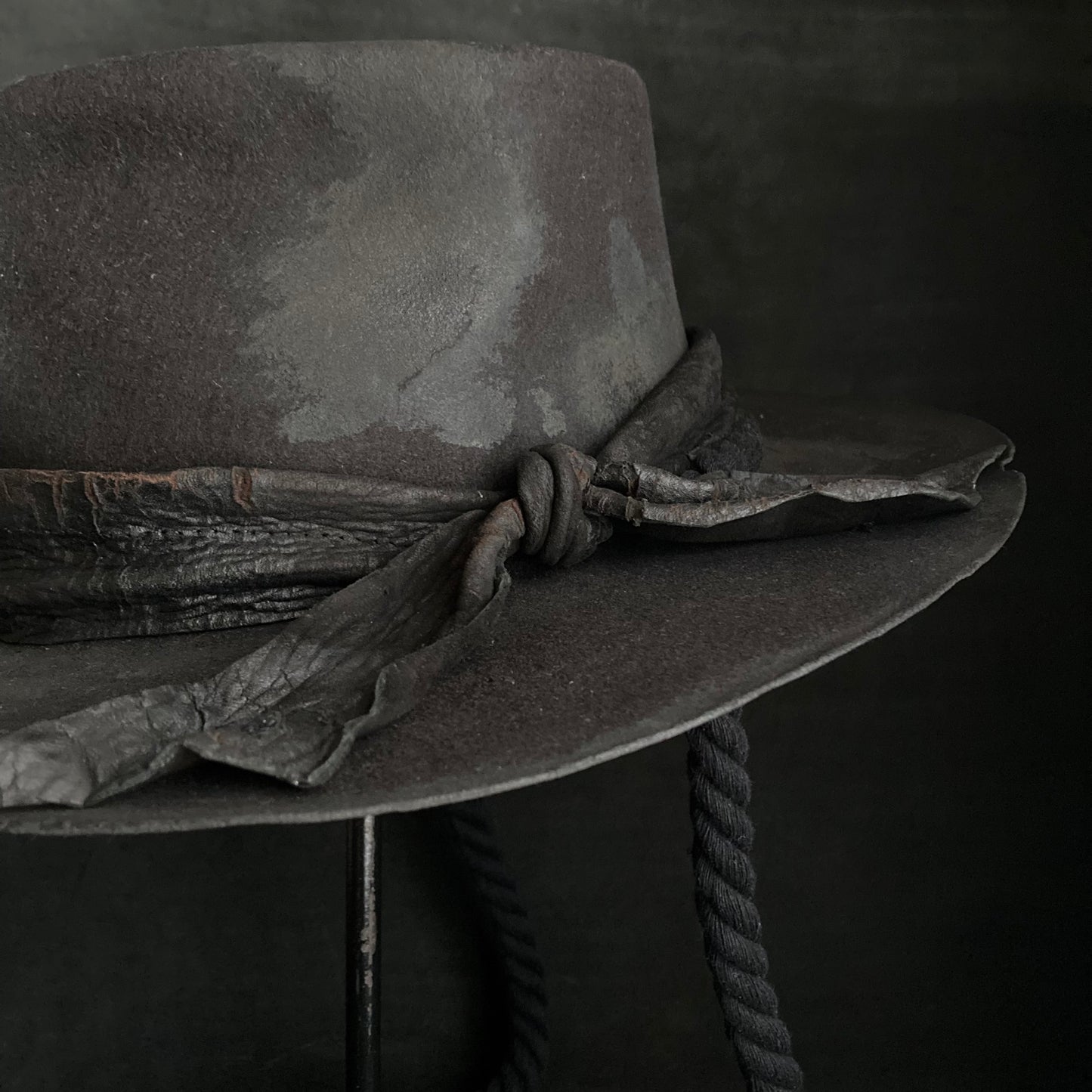 Burned black fedora hanging rope hat