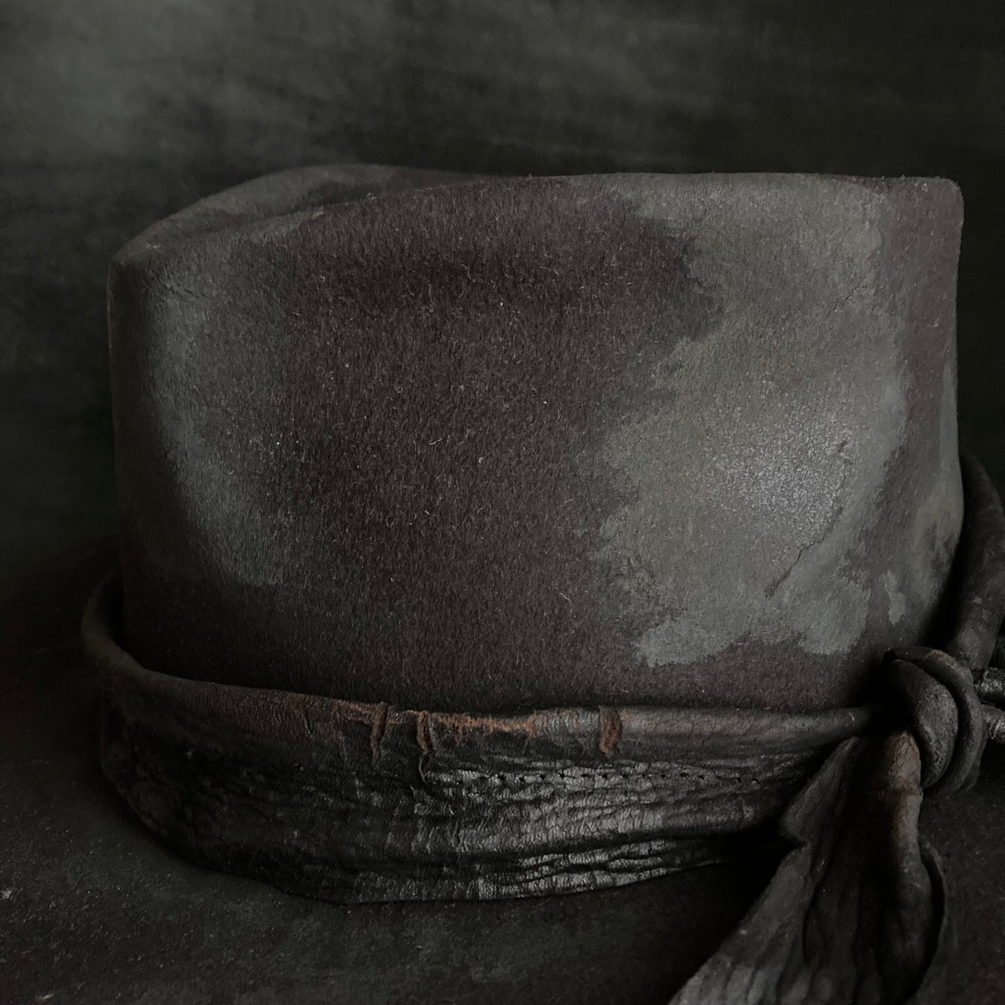 Burned black fedora hanging rope hat