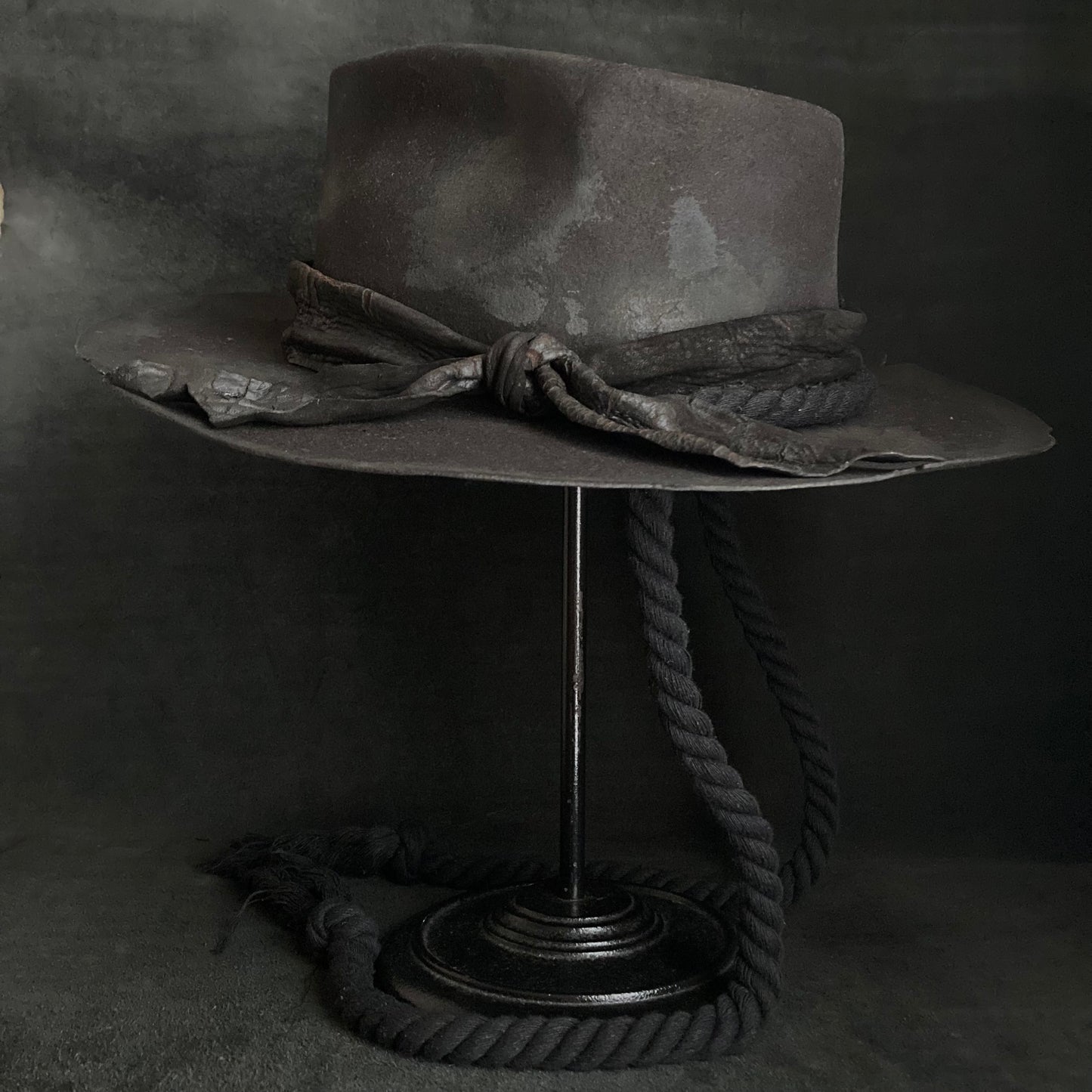Burned black fedora hanging rope hat