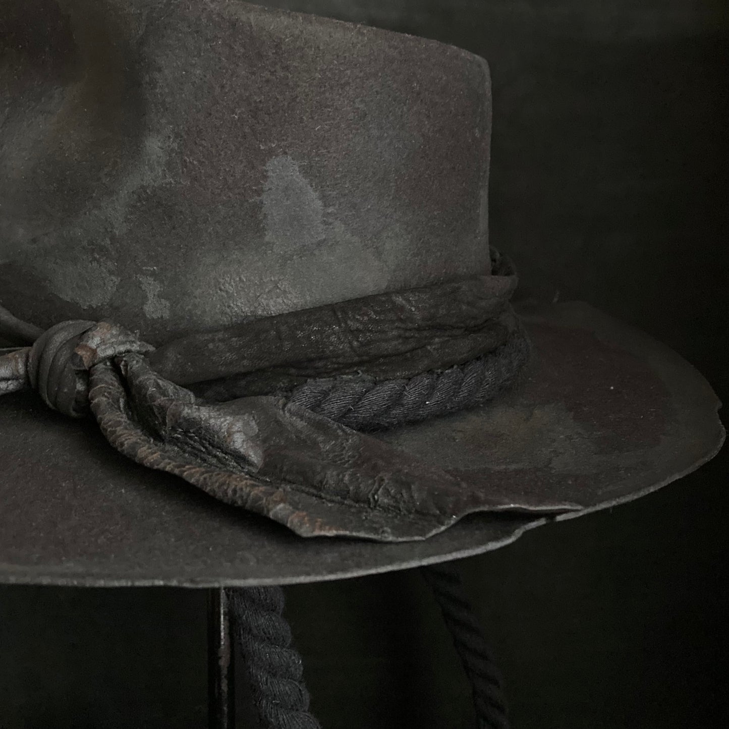 Burned black fedora hanging rope hat