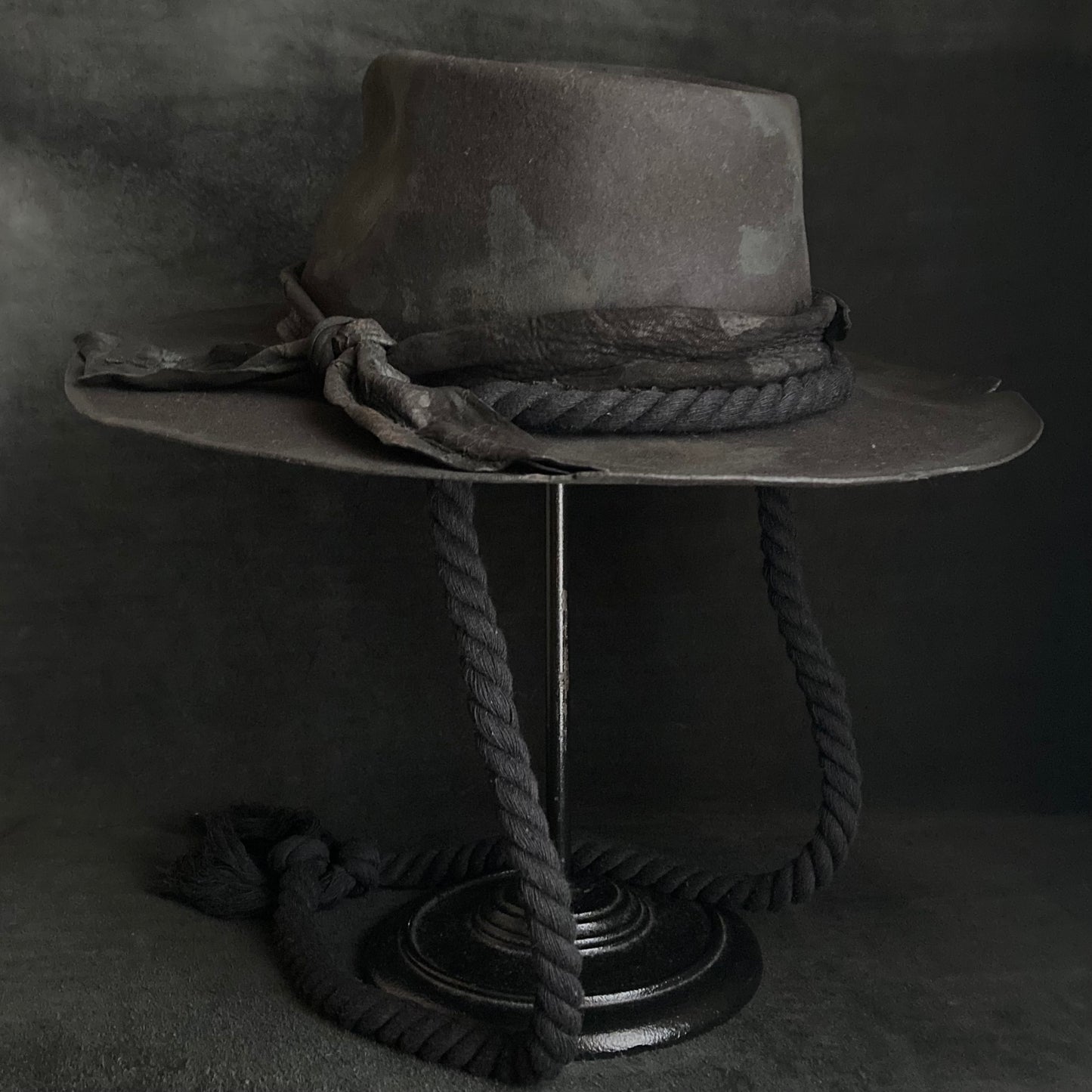 Burned black fedora hanging rope hat
