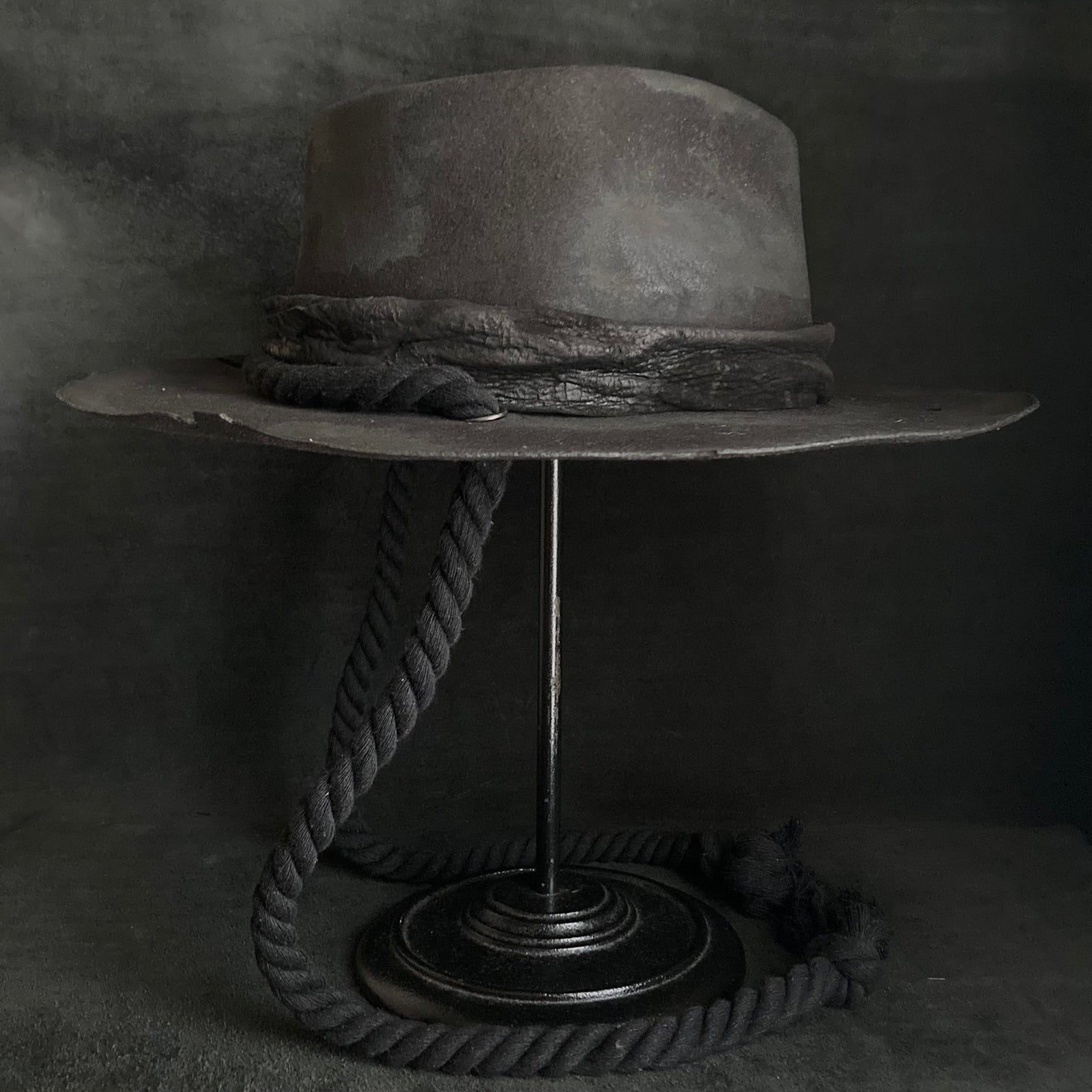 Burned black fedora hanging rope hat