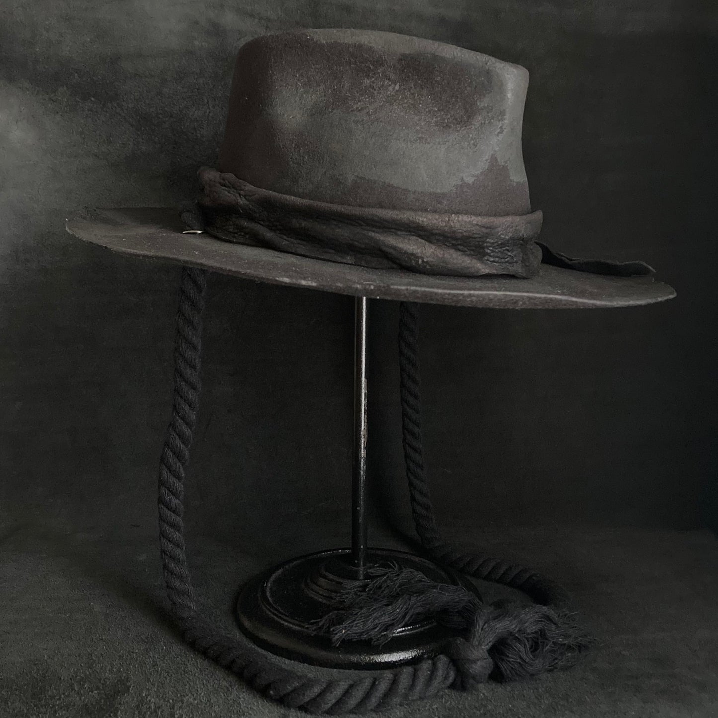 Burned black fedora hanging rope hat