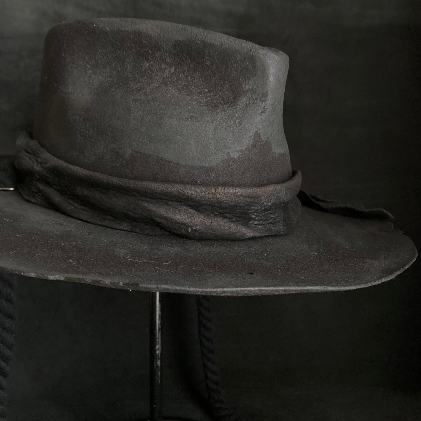 Burned black fedora hanging rope hat