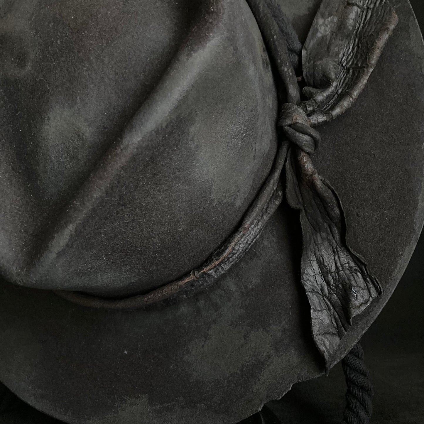 Burned black fedora hanging rope hat