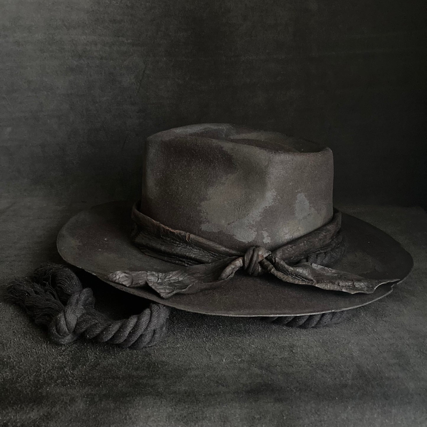 Burned black fedora hanging rope hat