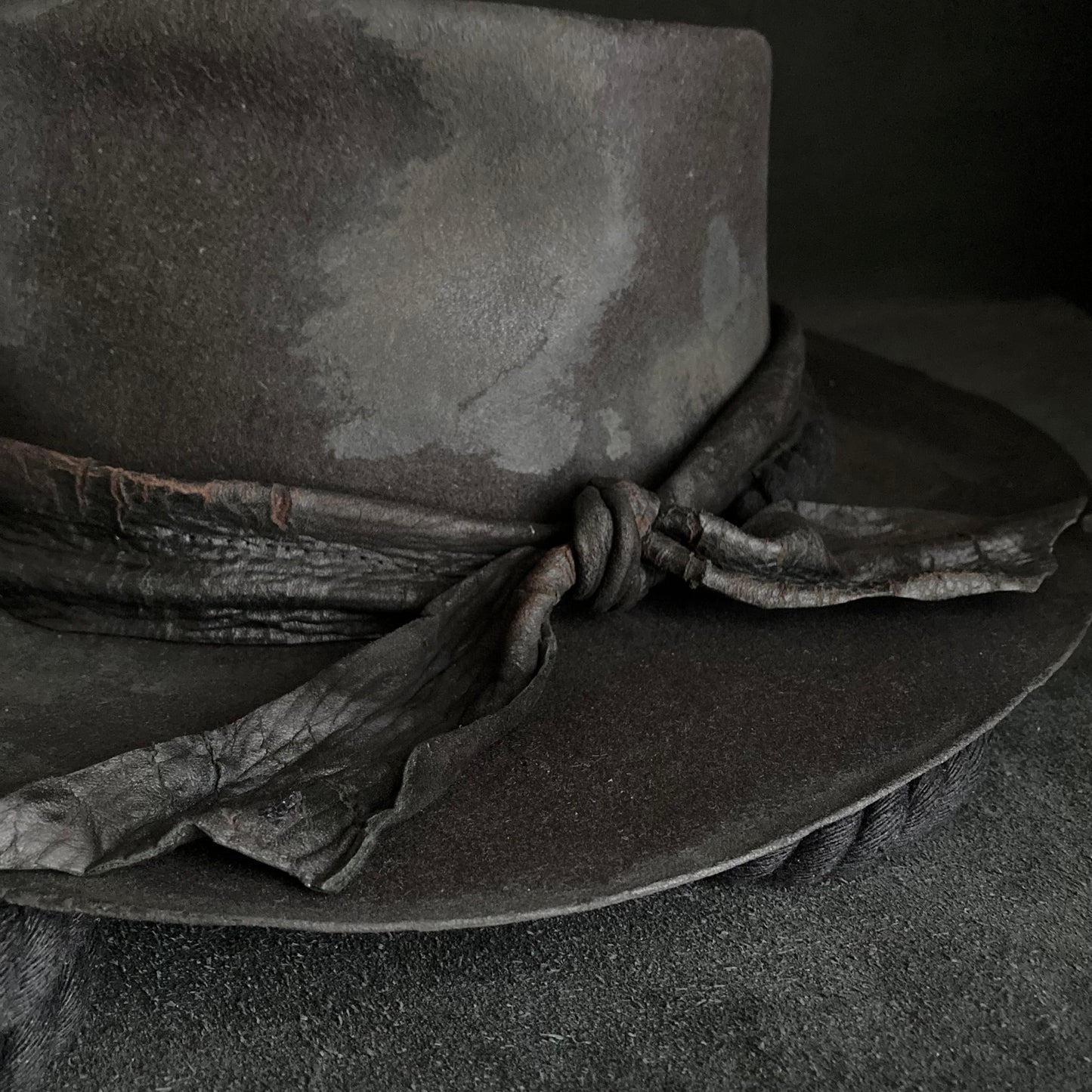 Burned black fedora hanging rope hat